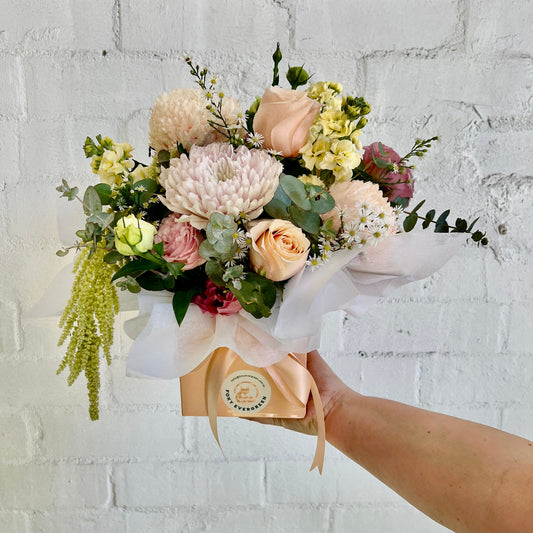 premium size box arrangement with pastel tones made into a peach box