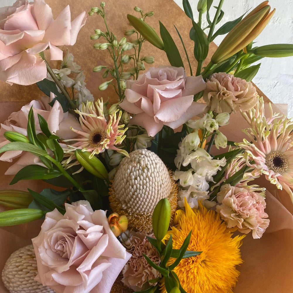 gerberas and roses in a mixed mothers day flower bouquet