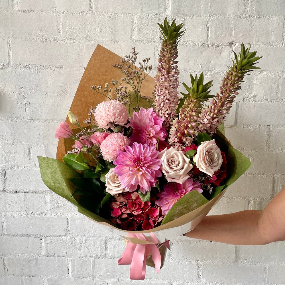 Mixed bouquet of pink roses, dahlias, pineapple lily and hydrangea