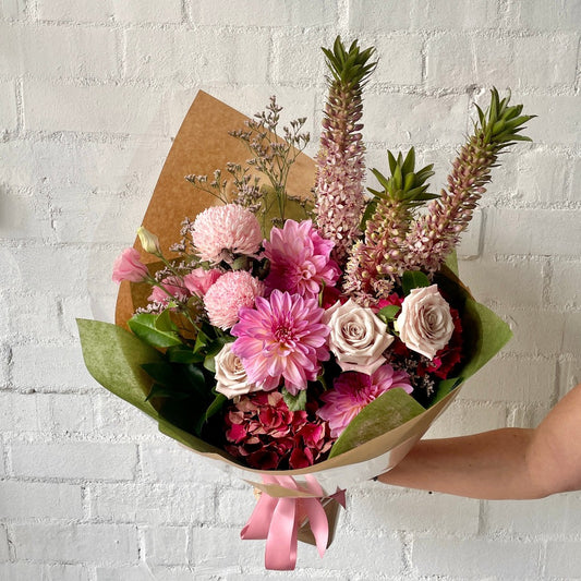 Mixed bouquet of pink roses, dahlias, pineapple lily and hydrangea