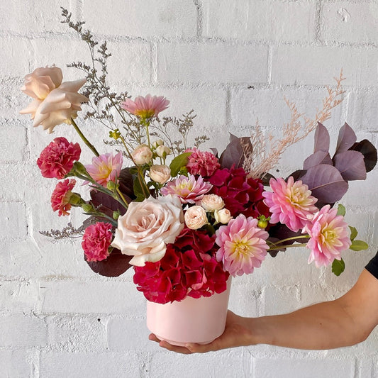 Fresh pink flower arrangement in ceramic pink vase