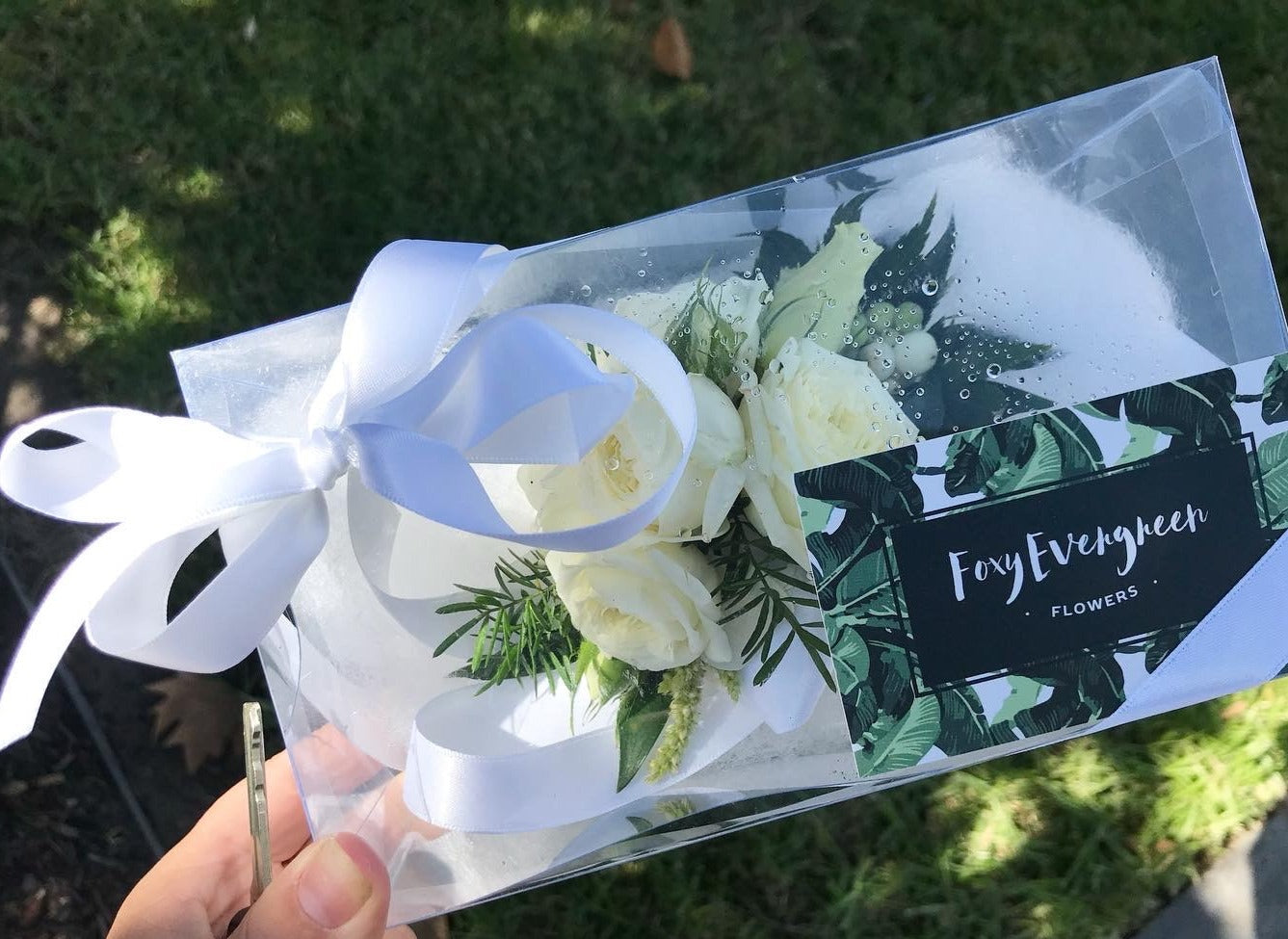 Buttonhole and wrist corsage with fresh flowers for school formal