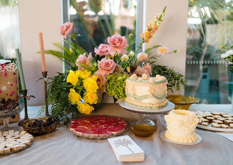 Pink rose and yellow bloom floral arrangement styled on a 50th birthday dessert table by Foxy Evergreen Melbourne