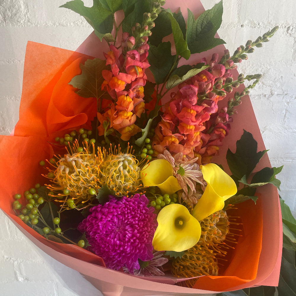 Bright, Colourful bouquet with hot pinks, yellows and oranges