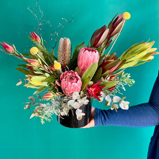 Australian Native Flowers in a black ceramic vase
