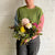 florist holding Fragrant Garden flowers with pink Disbud's, Chrysanthemum and garden foliage