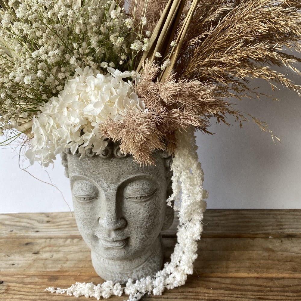 Buddha vase with preserved flowers
