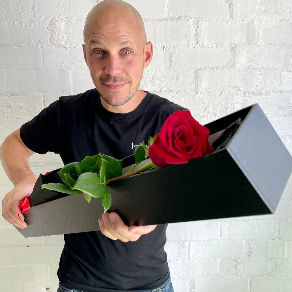 Single long stem red rose in a black premium box